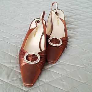 Bronze strap back shoes.